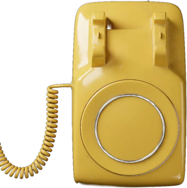 A bright yellow 1990s rotary dial telephone, photographed from above.